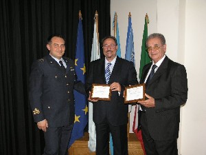 In October, Col. Giordano (l) recognizes Professor Bevilacqua (r) and Arch. Di Benedetti during the Probi Viri nomination ceremony.
